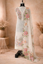 Ivory ethnic suit set with floral embroidery and matching dupatta displayed on mannequin