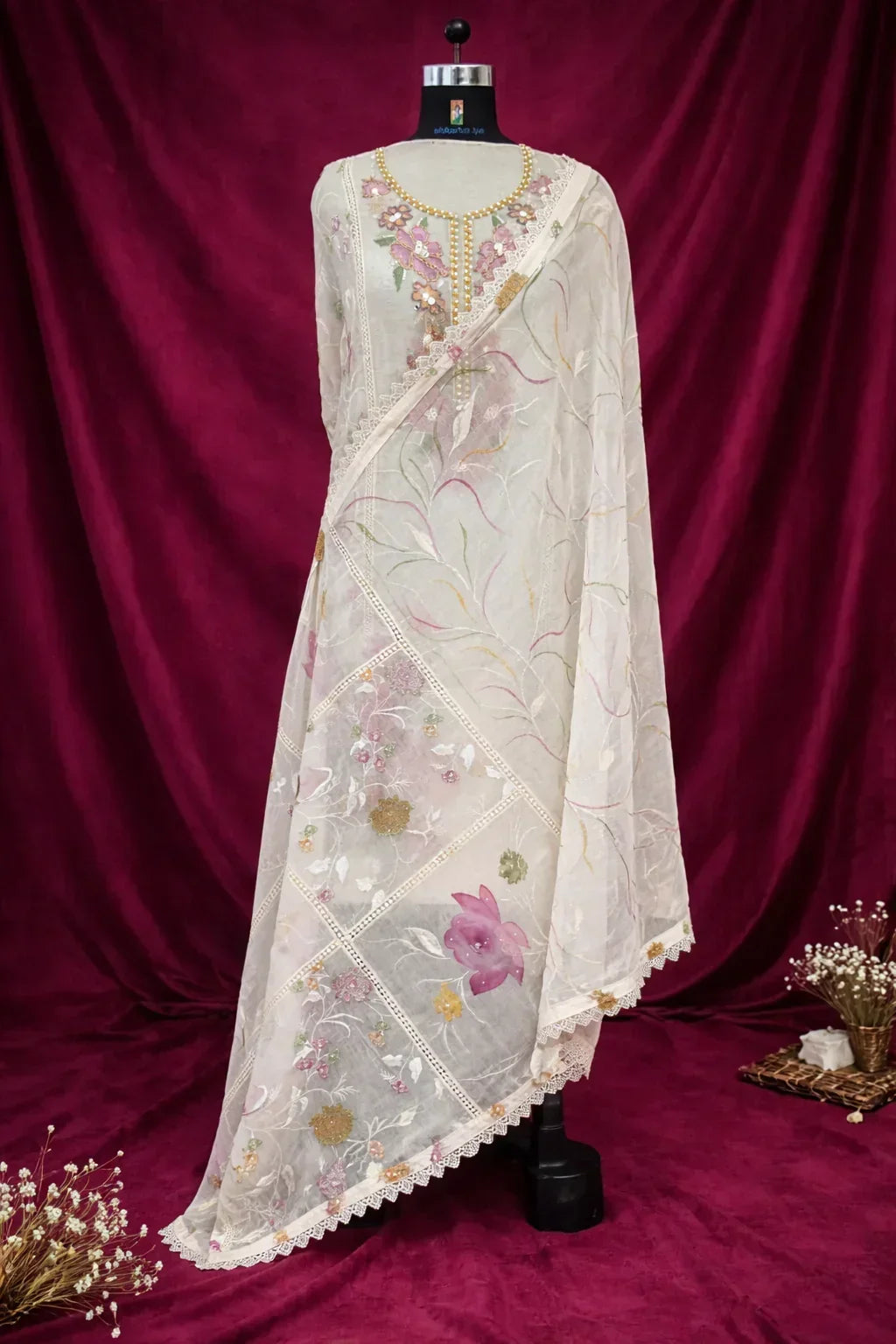 Ivory floral embroidered Anarkali suit with sheer dupatta, displayed on mannequin