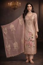 Woman in elegant pastel embroidered ethnic suit with floral motifs and matching dupatta