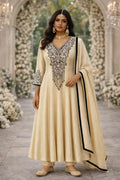 Woman in cream embroidered Anarkali suit with dupatta, floral backdrop, festive wear