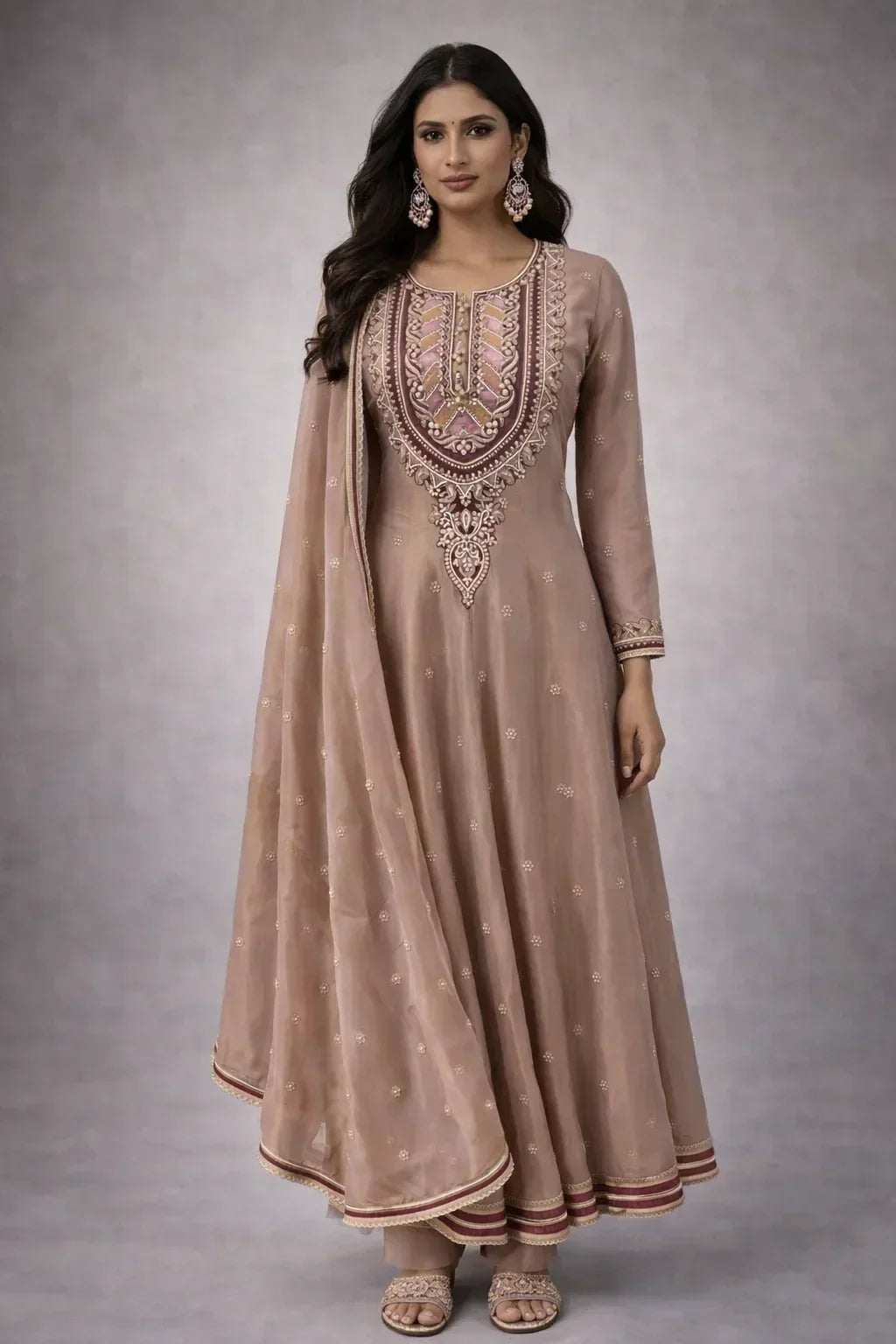 Woman in embroidered beige Anarkali suit with dupatta, ethnic wear for festive occasions